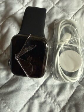 Black Smartwatch with White Magnetic Charger
